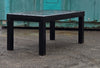 Saf-T-Cab ROPS heavy-duty black steel frame positioned outdoors on gravel.