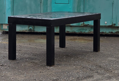 Saf-T-Cab ROPS heavy-duty black steel frame positioned outdoors on gravel.
