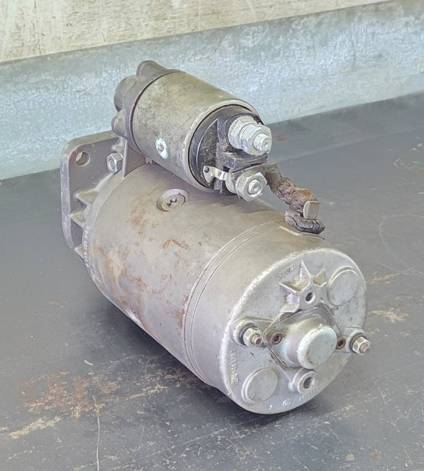: Bosch 0 001 369 014 12V 3.1kW 9-tooth starter motor side profile showing direct drive metal housing and attached solenoid
