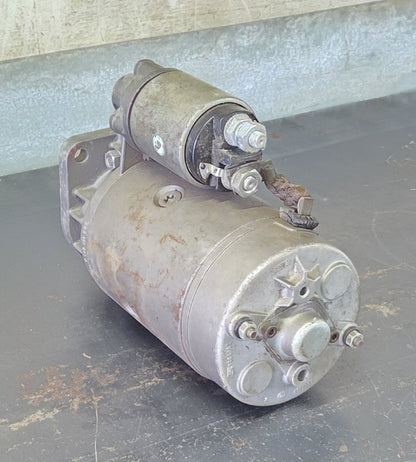: Bosch 0 001 369 014 12V 3.1kW 9-tooth starter motor side profile showing direct drive metal housing and attached solenoid
