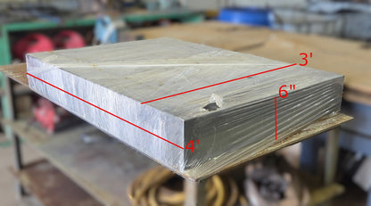  Solid rectangular block wrapped in clear plastic on a shop cart with red dimensional text indicating 4' length, 3' width, and 6" thickness.
