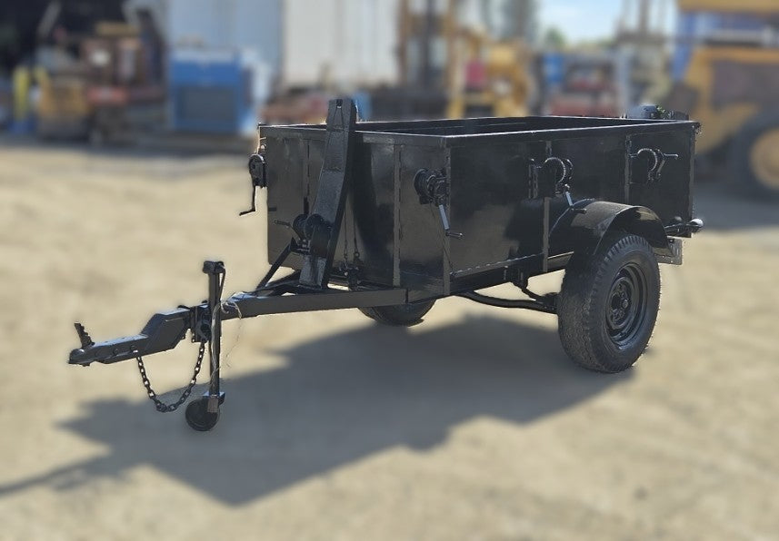  Front angle view of the black custom steel utility trailer showing the high sides, two side-mounted manual winches, and the A-frame tongue.
