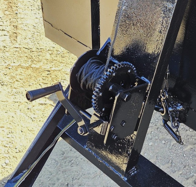: Close-up of the heavy-duty A-frame tongue, ball coupler, safety chains, and manual tongue jack.

