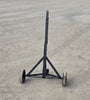 Trailer dolly with its 48-inch long handle folded into a vertical upright position for compact storage.