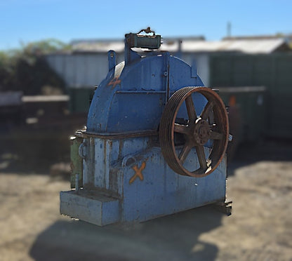 Fully assembled Precision 66-11 disc chipper showing the upper housing, pulley, and feed inlet opening.
