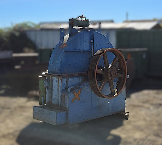 Fully assembled Precision 66-11 disc chipper showing the upper housing, pulley, and feed inlet opening.
