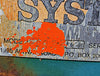 Extreme close-up of the data tag detailing Model 960-2-272 and Serial # 630-1077 partially covered by orange paint.