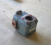 Angled view of the blue cast iron Metaris hydraulic vane pump showing the SAE 4-bolt port with red seal rings and heavy-duty housing