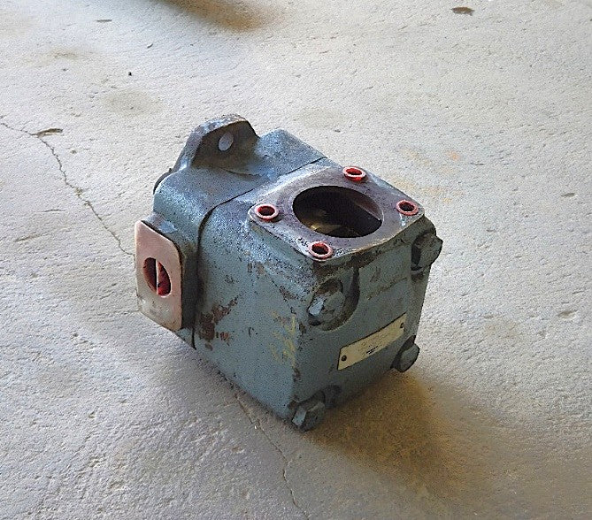 Angled view of the blue cast iron Metaris hydraulic vane pump showing the SAE 4-bolt port with red seal rings and heavy-duty housing
