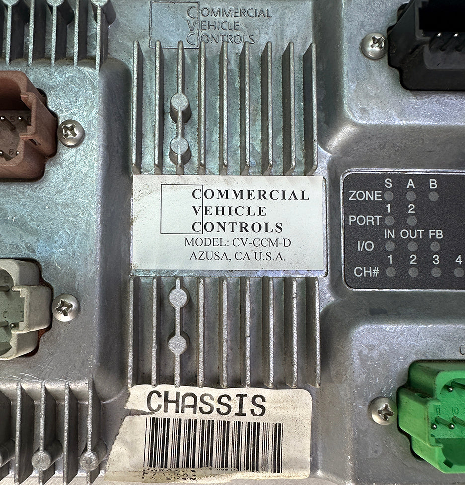 Close-up of the data tag on a Circle Automation CV-CCM-D chassis control module showing Azusa, CA origin and J1939 ports.