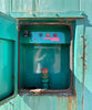 Cummins 100kW enclosed standby generator exterior fuel fill port compartment open showing fill pipe cap and tank level indicator lights