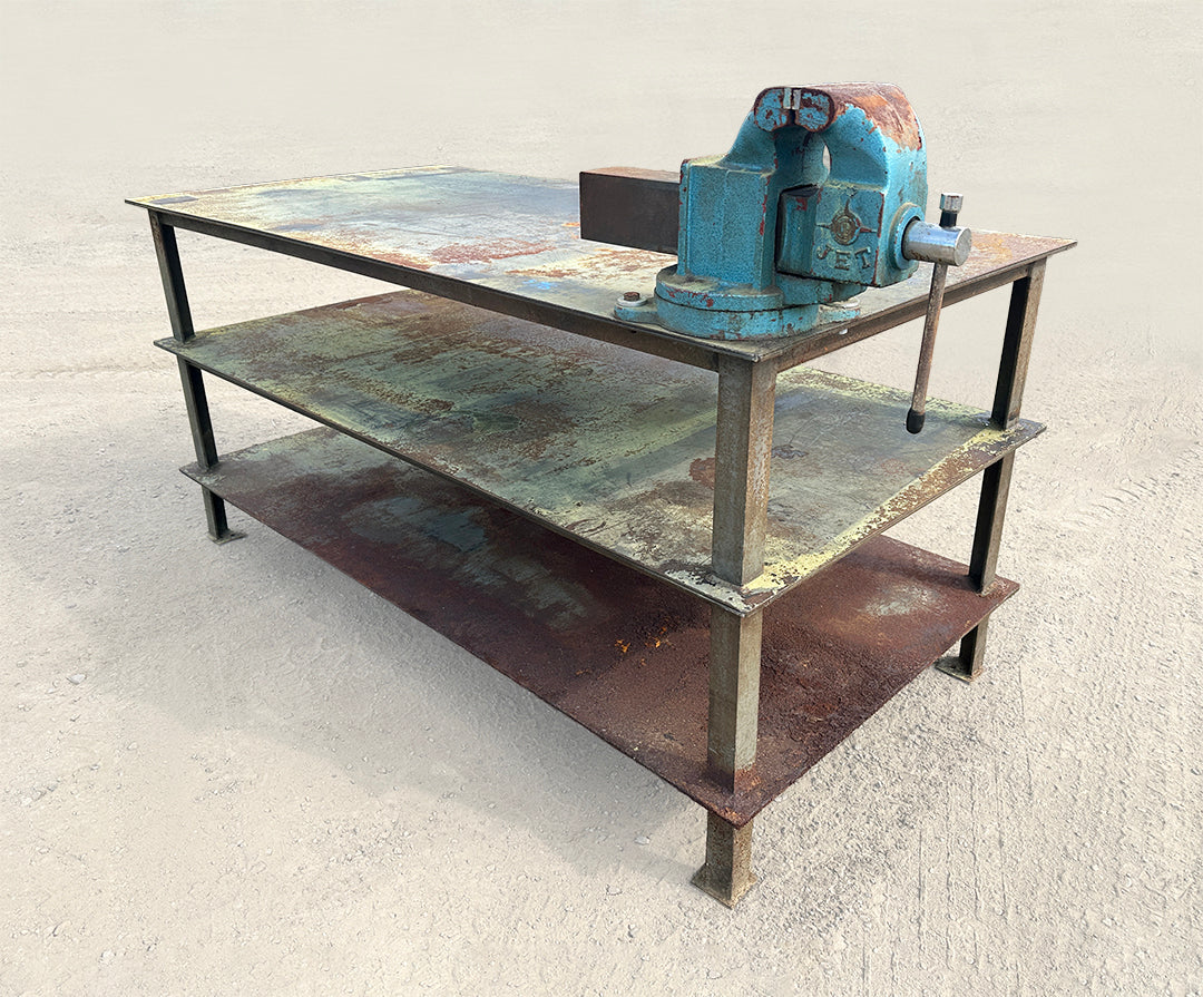 Heavy-duty steel industrial welding workbench 3-tier right side profile with attached JET vise 
